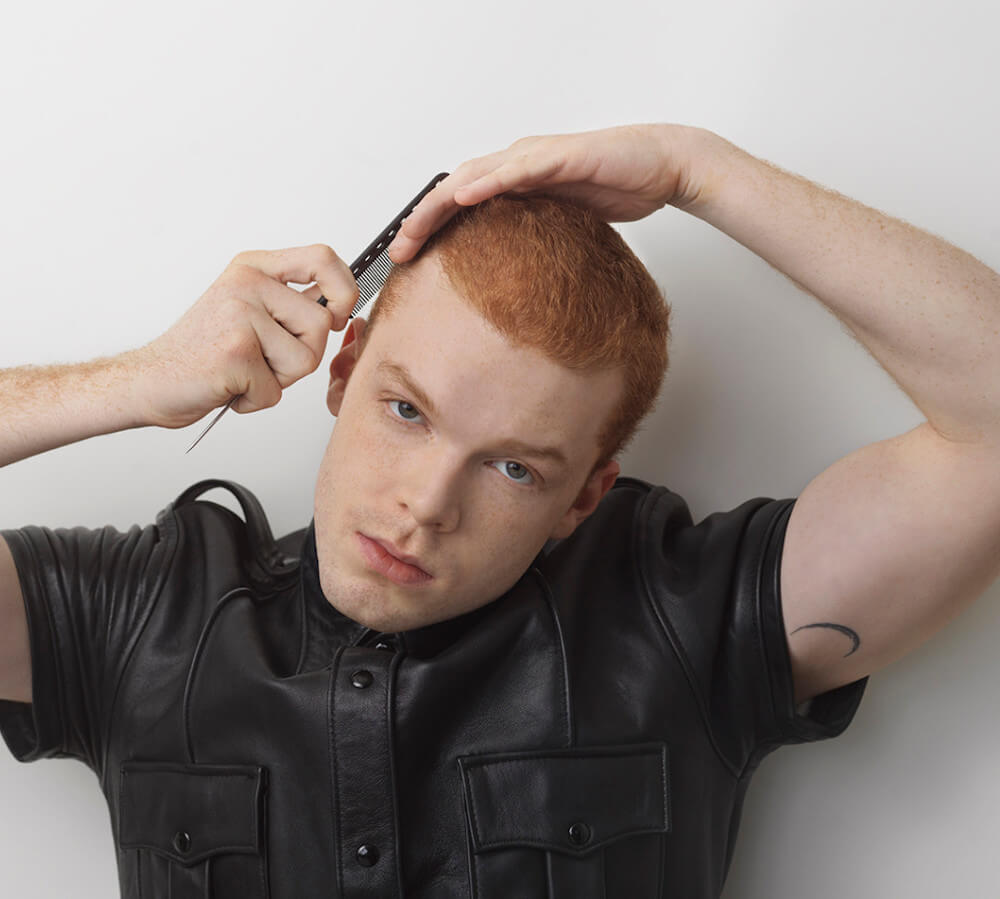 Cameron Monaghan bicep half-moon tattoo