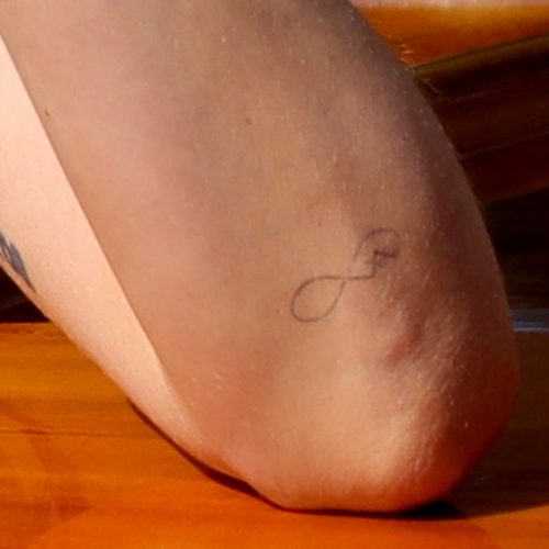 Dakota Johnson infinity symbol tattoo