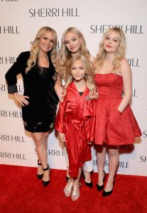 Emily Alyn Lind with mother and sisters