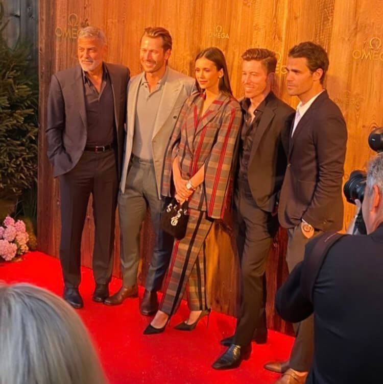 Glen Powell with Nina Dobrevin an Omega event