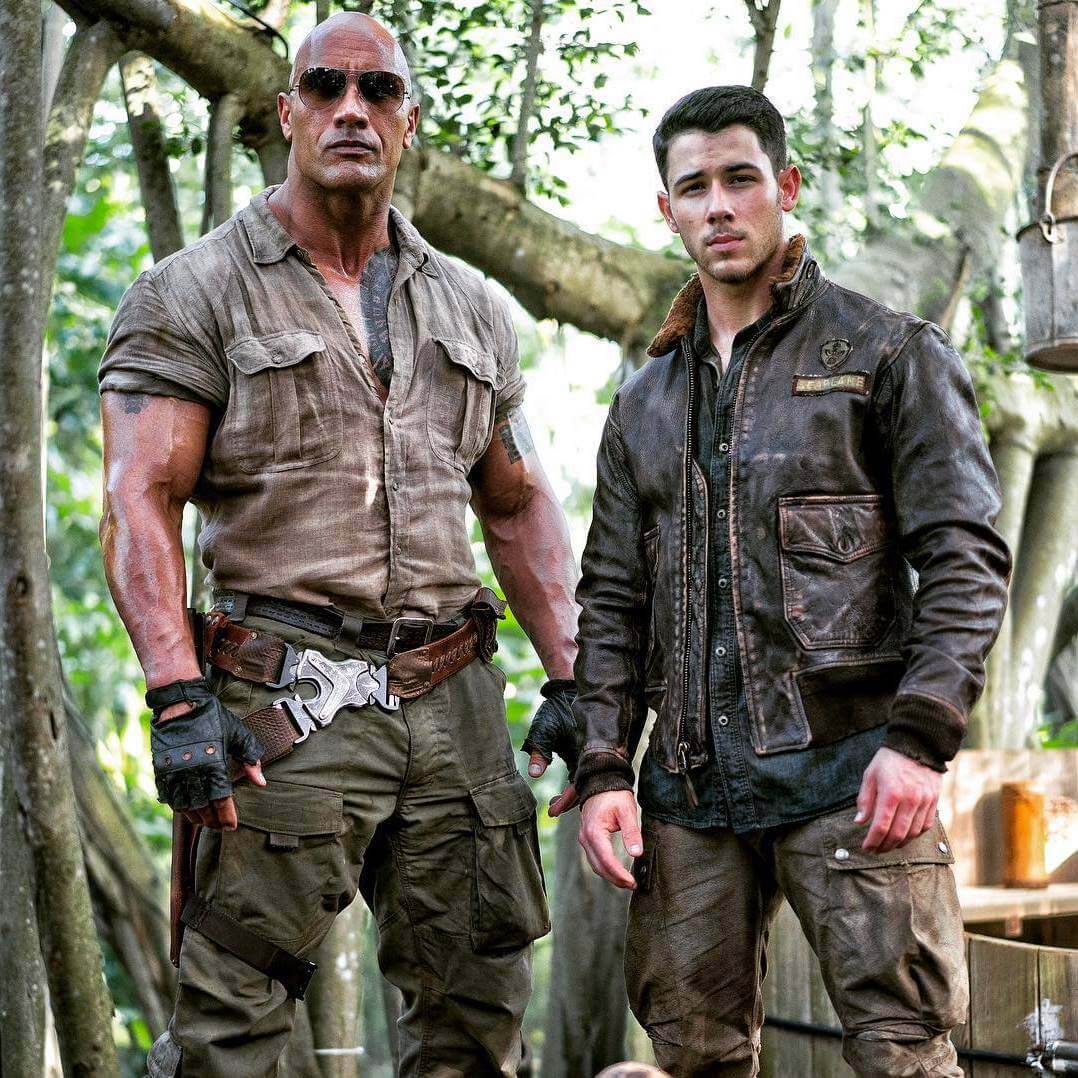 Nick Jonas with Dwayne Johnson in Jumanji (2017)