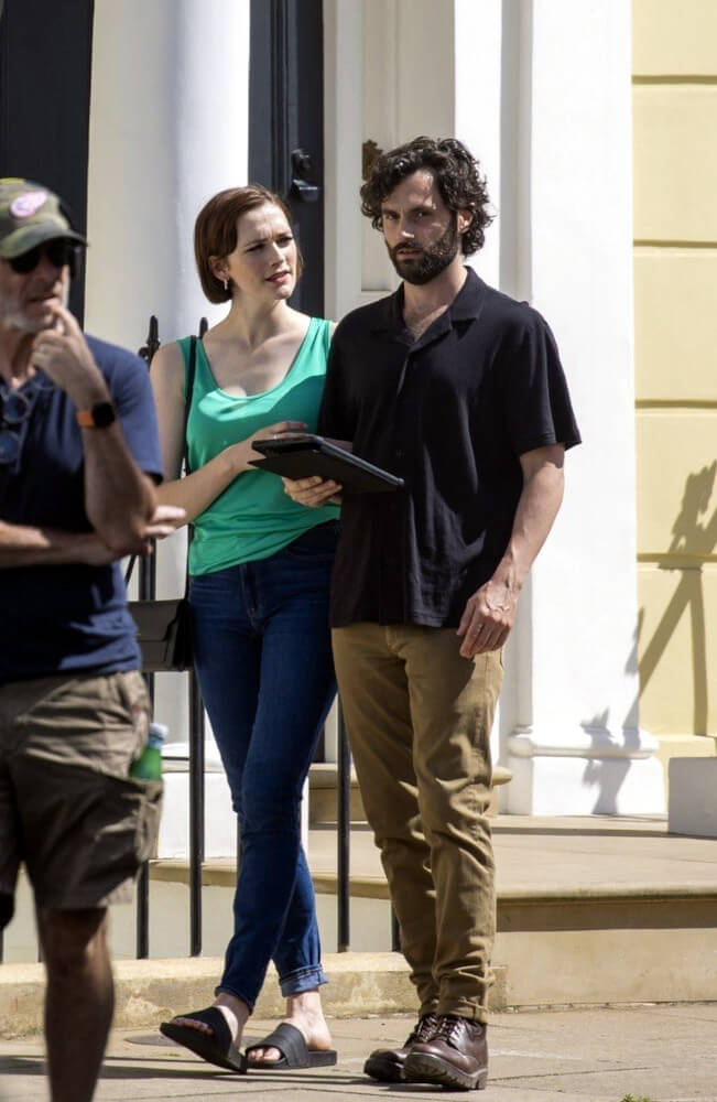 Penn Badgley with Charlotte Ritchie on the set of YOU S4