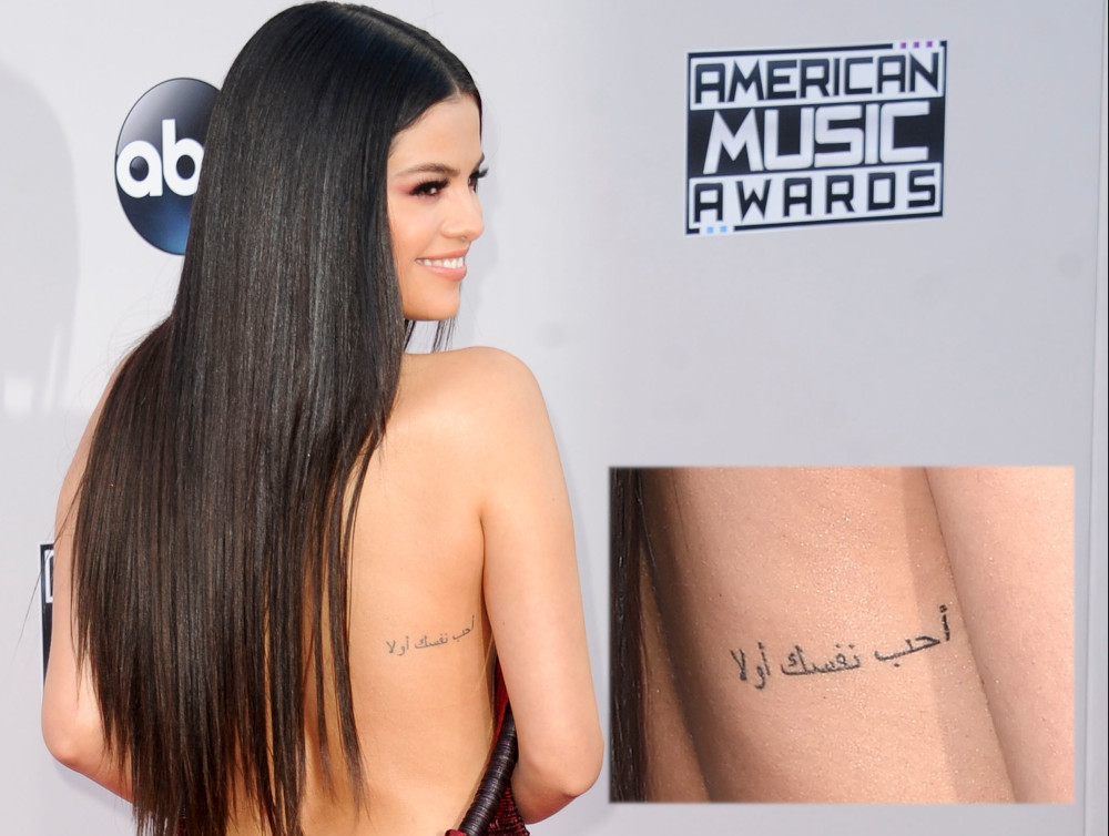 Selena Gomez arabic back tattoo