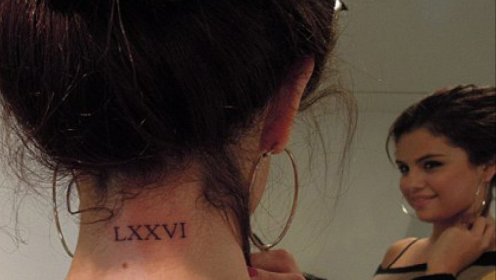 Selena Gomez roman numerals tattoo on the back of her neck
