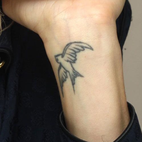 Sienna Miller swallow tattoo