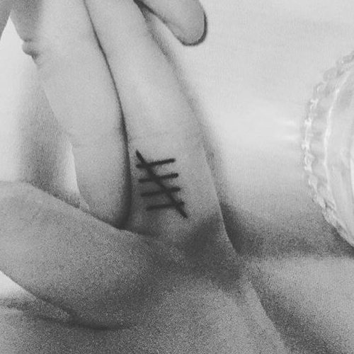 Sophie Turner five marks tattoo