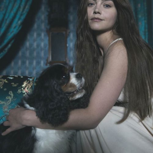Photo of Jenna Coleman as Victoria posing with Dash (aka Tori).